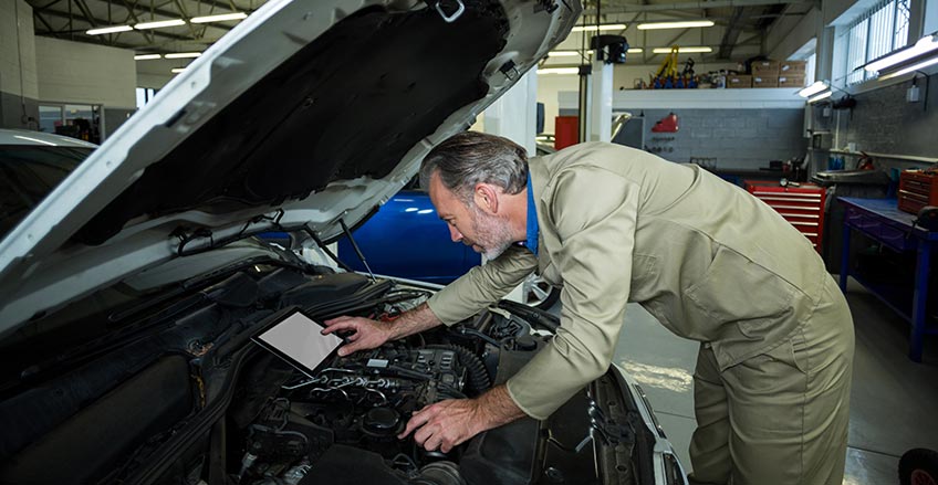 Technician running engine diagnostics