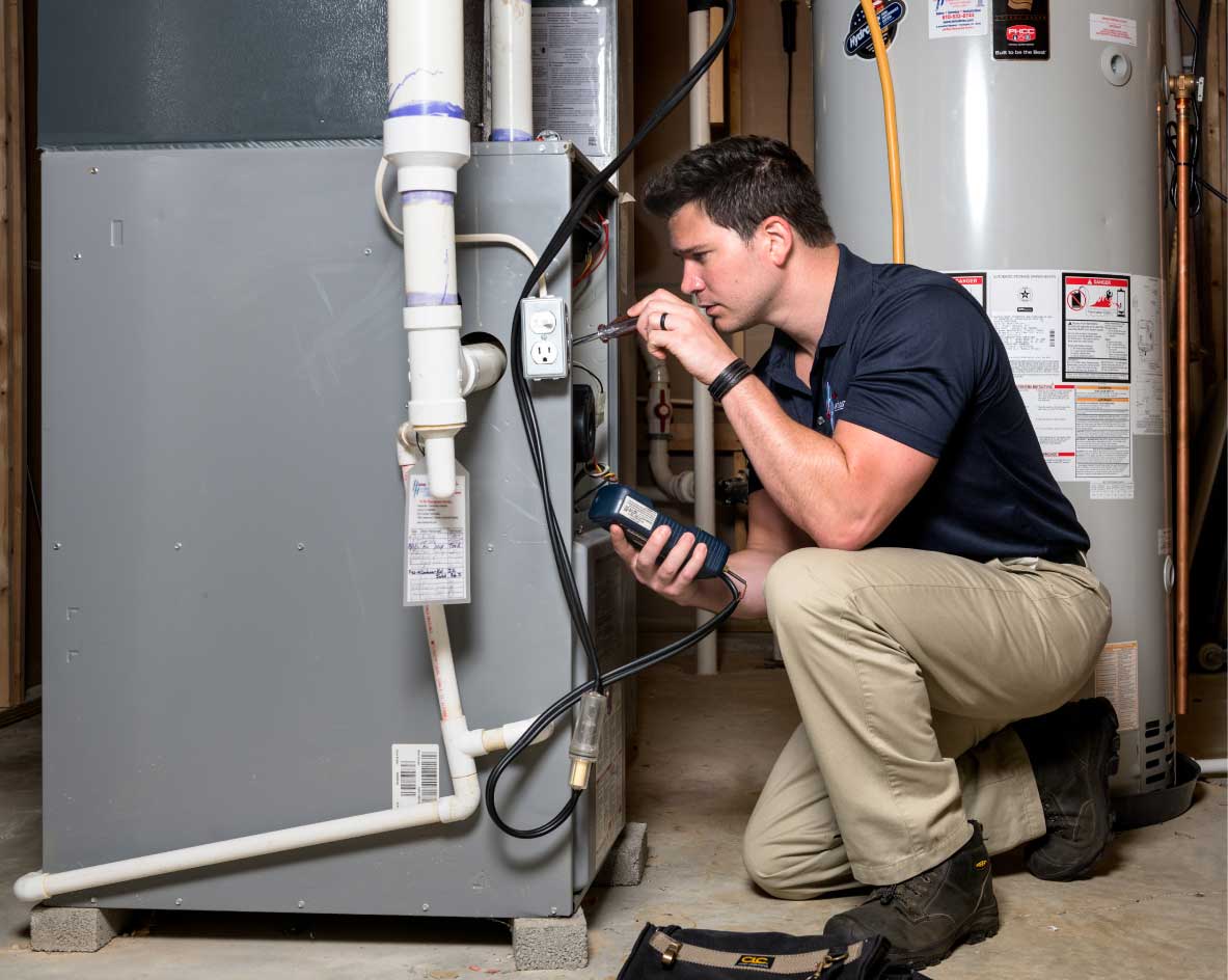 HVAC technician performing a furnace tune-up